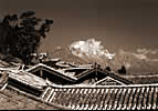 Photo: Across the rooftops of Lijiang to Jade Dragon Mountain. Trail: Travel China & Tibet - West out of Lijiang in Yunnan Province, north up the Mekong to Kham Tibet via Liming & Cizhong, passing through Lisu and Tibetan territory to Deqin & Mt. Kagebo (Meilixueshan).